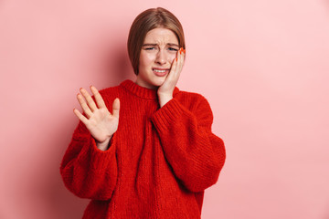 Photo of displeased blonde woman making stop gesture at camera