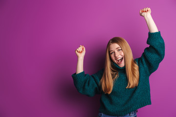 Photo of cheerful caucasian woman in green sweater smiling and dancing