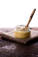 Vanilla custard with homemade cookie on wooden table. Top view. Copyspace