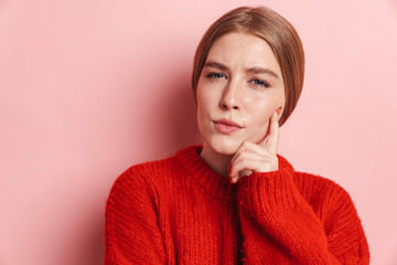 Photo of serious beautiful woman posing and looking at camera