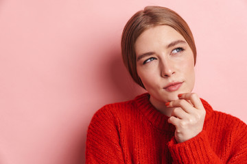 Photo of serious beautiful woman posing and looking upward