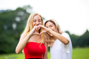 Photo of happy caucasian women taking selfie photo and laughing