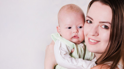 girl holds the baby in her arms. Close-up