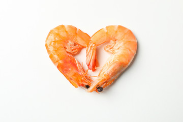 Heart made of shrimps on white background, top view