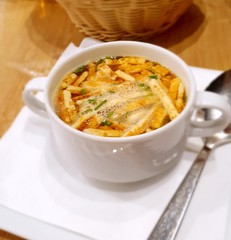 Broth soup in white bowl