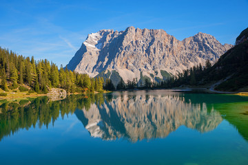 Obraz premium famous Zugspitze mountain mass reflecting in the lake Seebensee. hiking destination near Ehrwald