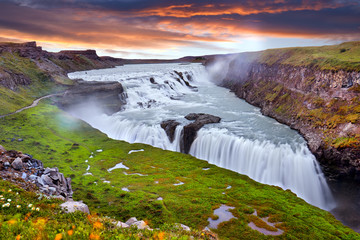 Panoramic view on Gullfoss waterfall on the Hvíta river, a popular tourist attraction and part of the Golden Circle Tourist Route in Southwest Iceland. Golden Waterfall. Travelling concept background. - obrazy, fototapety, plakaty