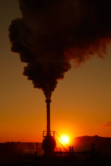 Alternative green energy. Geothermal power station pipeline and steam. Plant located at Reykjanes peninsula in Iceland, Europe.  Popular tourist attraction. Steaming hot water. Gunnuhver Hot Springs.