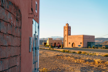 Small village with mosque by the feet of Atlas mountains, Morocco