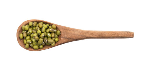 Brown wooden spoon with mung beans seen directly from above and isolated on white background