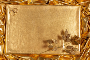 Background from a golden fabric with random drapery