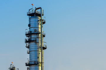 Oil and gas industrial, Oil refinery plant from industry, Refinery oil with copy  space with blue sky and white clouds background.