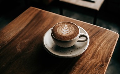 cup of coffee on wooden table