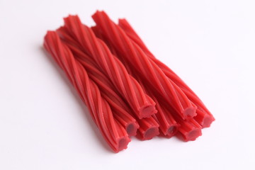 sweet red gummy licorice in color background