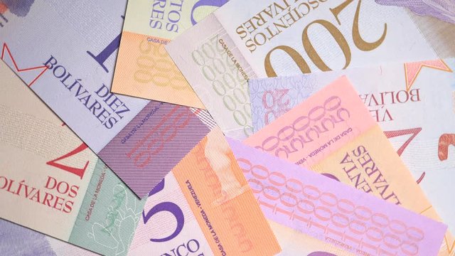 Rotating Reverse Venezuelan Bolivar Banknotes 2018 On Turntable Top View..
