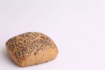 delicious bread rolls on colored background