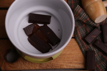 melting chocolate tablet in color background