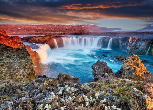 Incredible frosty morning and sunrise at the most famous place of Golden Ring Of Iceland. Godafoss waterfall near Akureyri in the Icelandic highlands, Europe. Popular tourist attraction. Postcard. © zicksvift