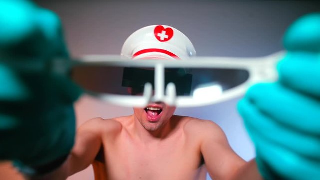 The dancer in a white cap and glasses suggests putting on white glasses