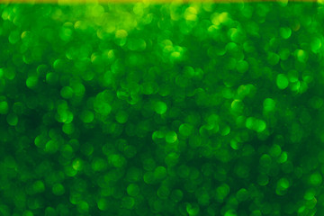 Abstract light, green bokeh pattern. Happy St Patricks Day or Holiday concept, background image