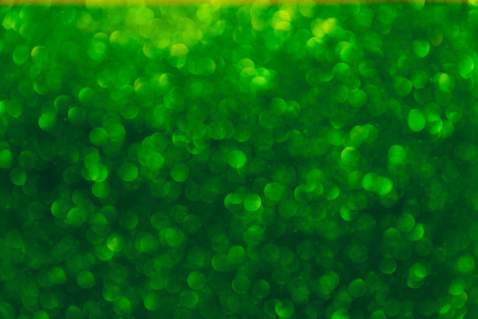 Abstract light, green bokeh pattern. Happy St Patricks Day or Holiday concept, background image