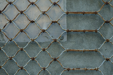 Old metal grill. Shod lattice. Metal structure.