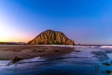 Rock on Beach with Reflection at Sunrise, sunset 