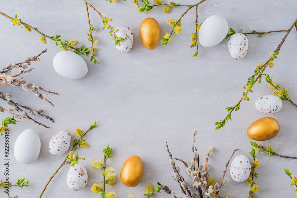 Wall mural flat lay easter composition with a willow branch and eggs on a gray background