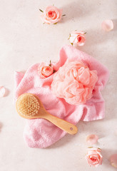 sponge brush towel and rose flowers. wellness home spa treatment