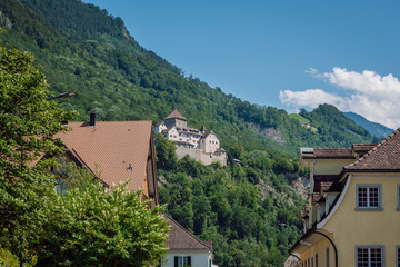 Fototapeta na wymiar View of Vaduz Castle ( Schloss Vaduz ) situated on a green hill above the capital of Liechtenstein, the city of Vaduz.