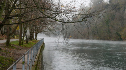 River in a foggy  grey day