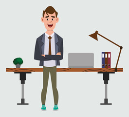 cute businessman stands near his table or workplace