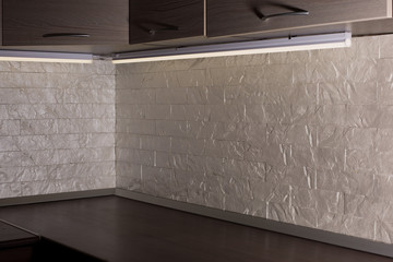 kitchen furniture against brick wall background