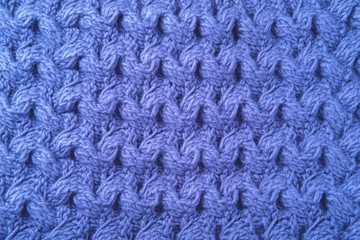 Beautiful wool knitted background in blue color.