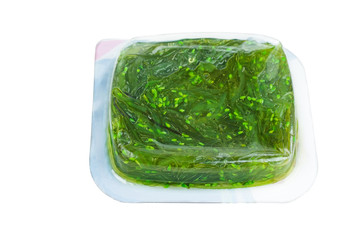 Wakame seaweed in plastic box isolated on white background