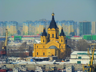 Obraz premium Orthodox Cathedral on the background of modern buildings in the city of Nizhny Novgorod, Russia.