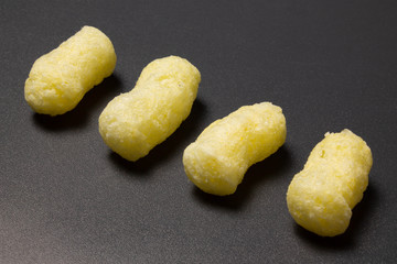 Corn sticks close-up on a dark background