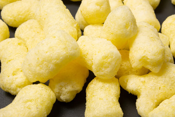 Corn sticks close-up on a dark background