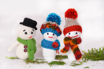 Waldorf woolly handmade snowmans on white background