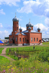 Wildflowers and an Orthodox Church in summer in the resort town of Belokurikha in Siberia
