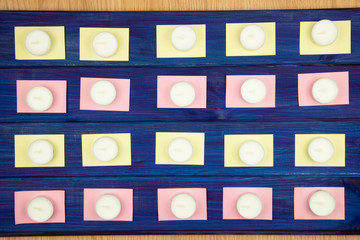 background of wooden boards in blue-notes for notes and a lot of candles
