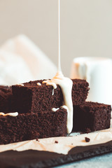 Homemade dark chocolate fudge brownies cake. chocolate brownie with melted white chocolate fudge