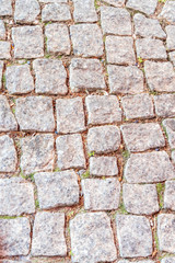 Old grey pavement of cobblestones