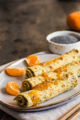 poppy seed crepes (blinis). pancakes with poppy seeds and tangerine jam