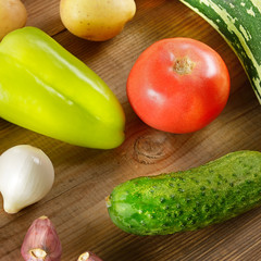 Vegetables laid out on a wooden table. Flat lay,top view.