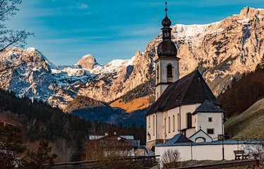 Fototapeta na wymiar Beautiful church with mountains in the background at Ramsau, Berchtesgaden, Bavaria, Germany