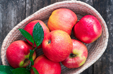 Ripe red and yellow apples on table close up