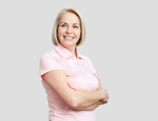 Friendly smiling middle-aged woman isolated on white background