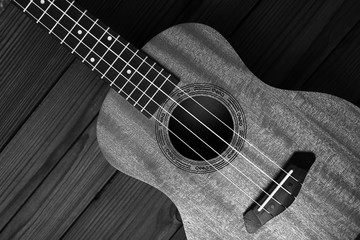 Obraz premium Ukulele on wooden background