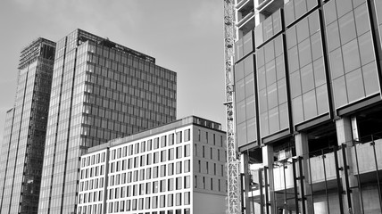 Fototapeta premium Abstract modern architecture with high contrast black and white tone. Architecture of geometry at glass window - monochrome.